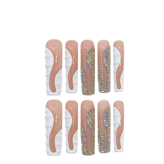 Set of false nails with white and beige designs on a white background