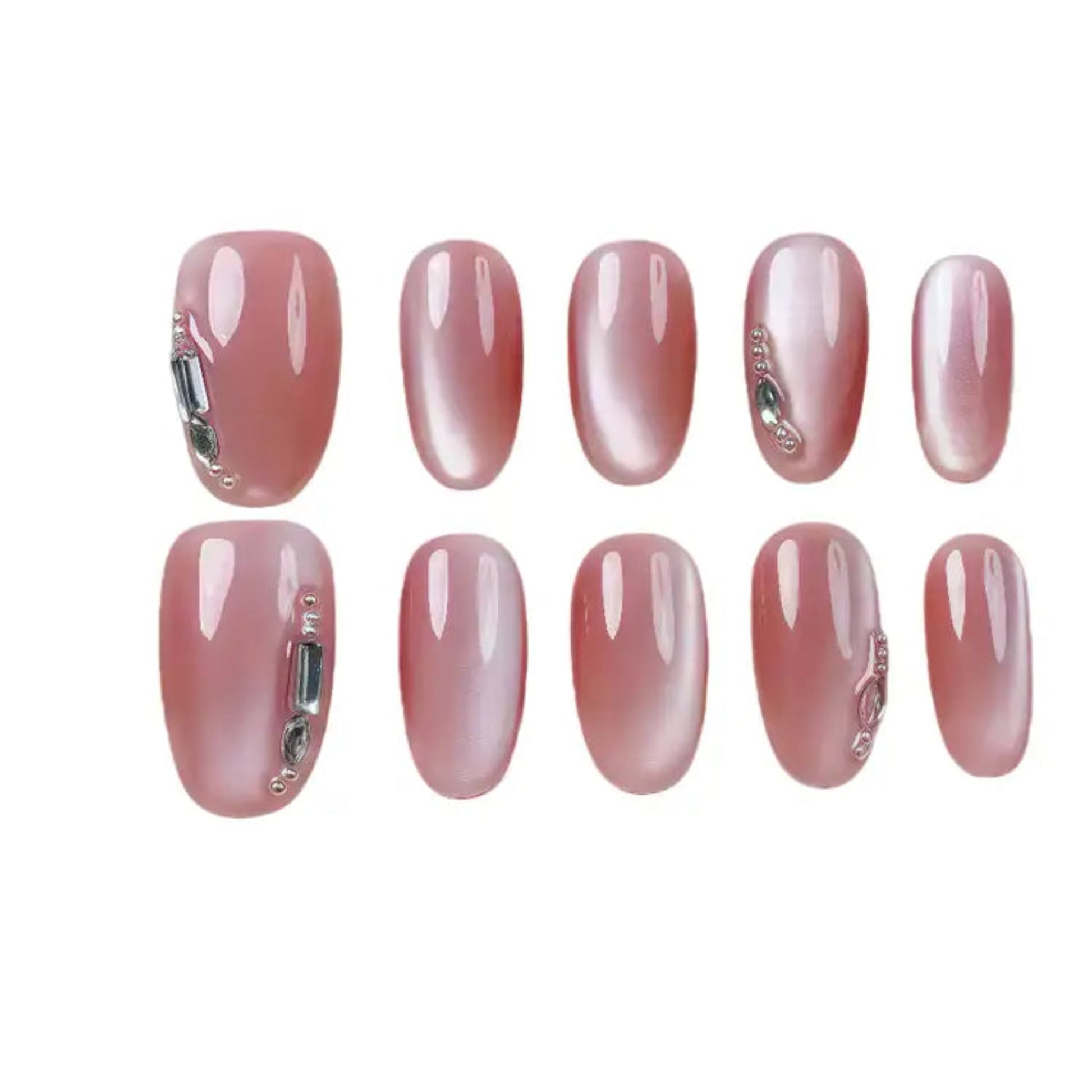 Set of pink nail extensions with decorative elements on a white background