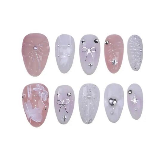 Set of decorative false nails with various designs on a white background