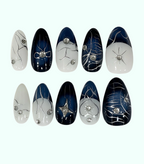 Set of nail art designs with decorative elements on a white background