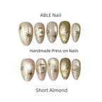 Handmade press-on nails with decorative designs on a white background, labeled 'ABLE Nail'.