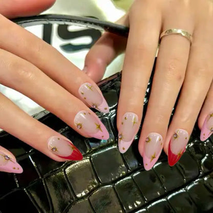 Close-up of hands with pink and red nail polish on a textured surface