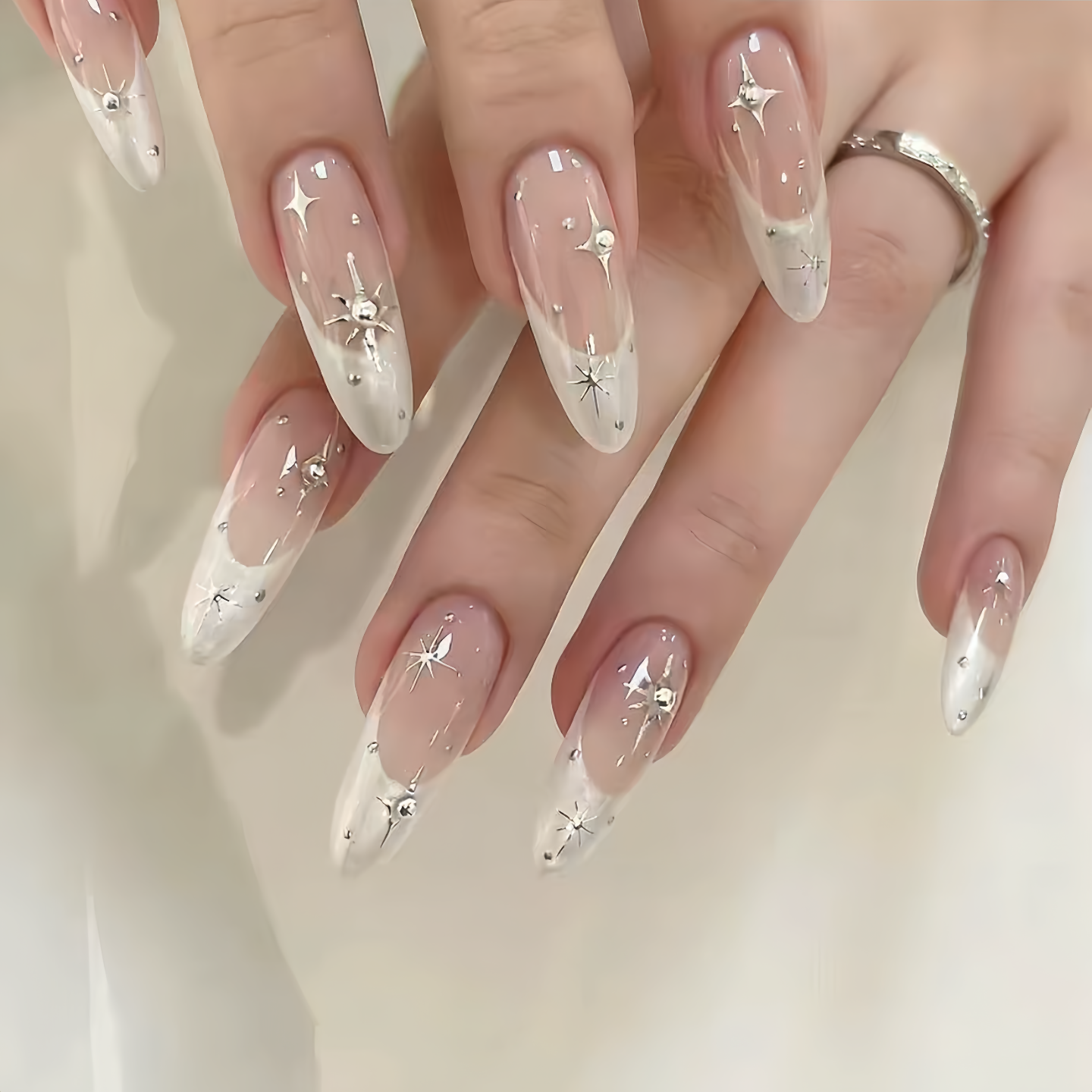 Nails with star and heart designs on a light background