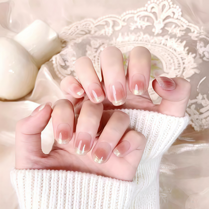 Close-up of hands with French manicure on a lace doily background
