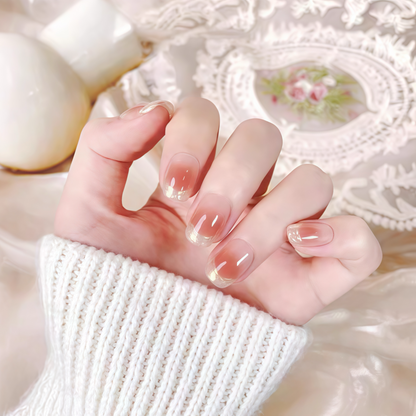 Hand with French manicure on a soft, blurred background