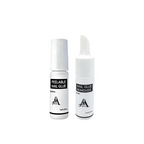 Two bottles of peelable nail glue and remover on a white background
